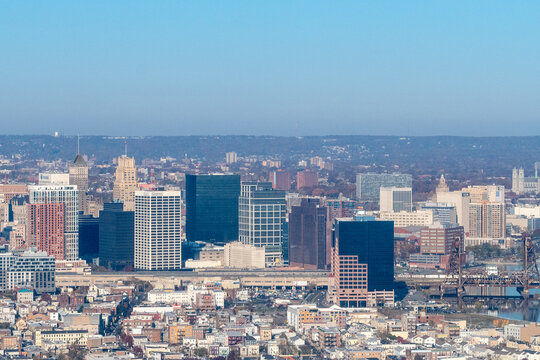 Aerial view of Newark, New Jersey shows a dense urban landscape with a mix of modern skyscrapers and older buildings. 