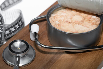 Diet and heart health concept with canned tuna.