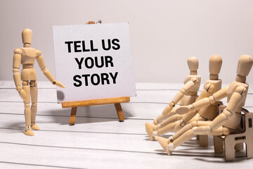 Tell us your story symbol. Concept words Tell us your story on wooden blocks.