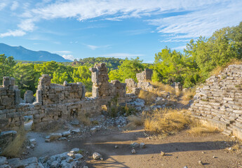 Fototapeta premium The theatre of the ancient city of Faselis or Phaselis. It is an ancient Greek and Roman settlement. Ancient cities on the Mediterranean coast of Turkey. Kemer district, Antalya city, Turkey country