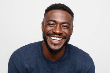 Obraz premium Joyful African American Man Beaming White Smile Against Neutral Studio Background