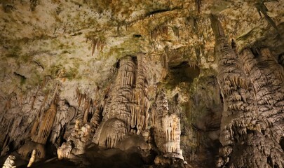 stalagmites and stalactites in s huge cave