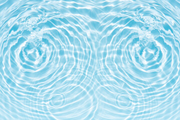 Blue water with ripples on the surface. Defocus blurred transparent blue colored clear calm water surface texture with splashes and bubbles. Water waves with shining pattern texture background.