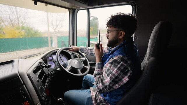 Truck driver communicating using cb radio while driving