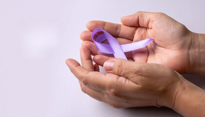 Purple Awareness Ribbon Held In Hands Health Support Concept