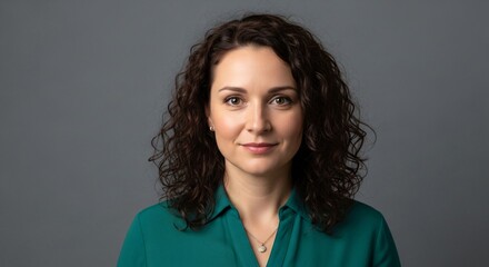 a woman in a green shirt posing for a picture