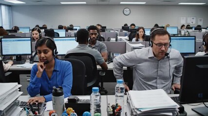 Diverse team working in a busy call center, providing customer service and support. - Powered by Adobe