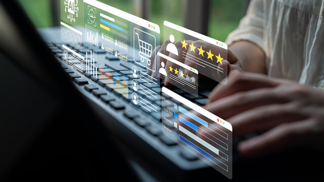 A focused individual types on a laptop while digital graphics float above, representing e-commerce trends and customer feedback in a contemporary work setting. Gantry
