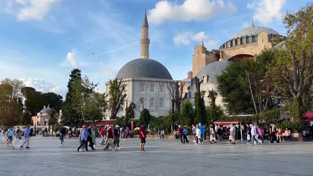 Sultanahmet Square behind Hagia Sophia (Ayasofya) at Sultanahmet District in Istanbul, Turkey. (4K video)