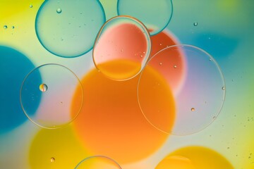A colorful abstract image of oil droplets on a vibrant background