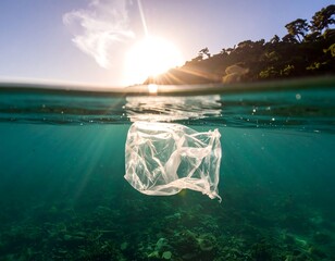 Submerged plastic bag in clear ocean water under the sun