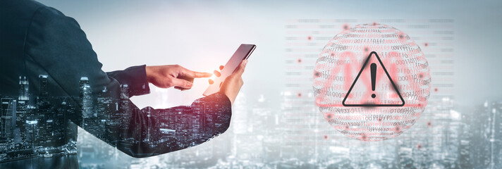 A person interacts with a smartphone, highlighting a digital security alert. The cityscape background enhances the theme of technology and cybersecurity. Gantry