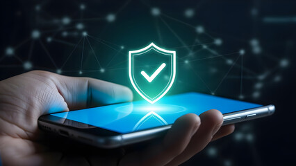 A hand holds a smartphone displaying a prominent, glowing shield icon with a checkmark, symbolizing digital security and reliable protection.