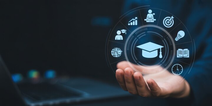 Digital education and e-learning concept with graduation cap icon hovering over a hand and laptop - Powered by Adobe