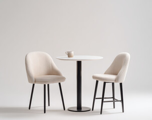Minimalist round white table with smooth surface and black metal pedestal base, paired with two contemporary upholstered chairs with curved backs and black wooden legs