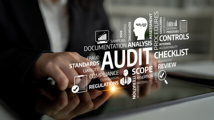 A close-up view of a professional using a tablet, highlighting essential audit concepts like compliance, standards, and review processes within a business setting. Tessel