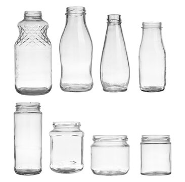 collection of eight assorted empty clear glass bottles and jars, presented on a transparent background for a clean, isolated look, ideal for product mockups and e-commerce.