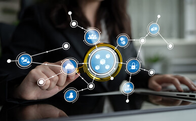 A business professional interacts with a virtual network of digital icons representing technology and communication concepts, emphasizing modern office dynamics and data management. Crux