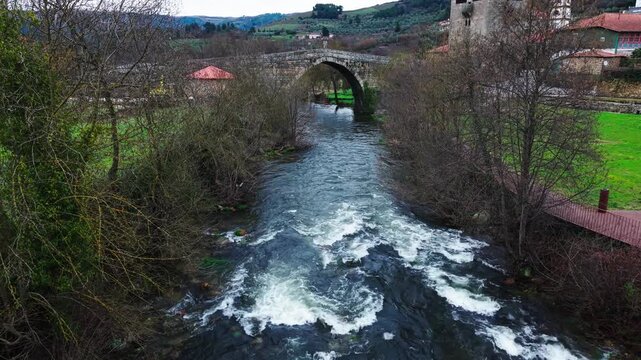 Varosa river near fortified Ucanha bridge, Ucanha village after sunset, Aerial