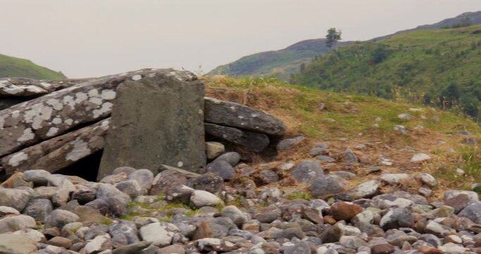 Panning right to left mid shot of the South Cairn southern chamber Entrance at Nether Largie Standing Stones at Kilmartin
