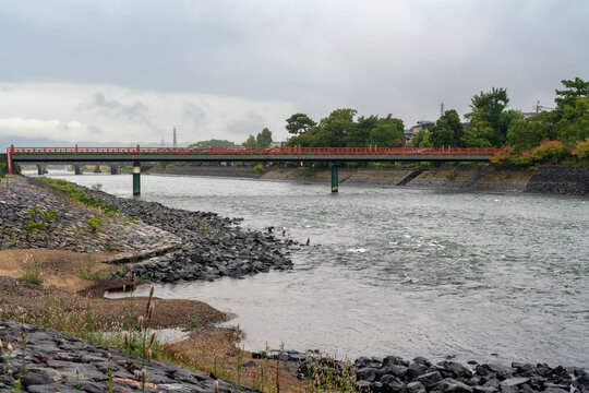 Uji River and Uji Bridge in the southern suburbs of the city of Kyoto on a cloudy autumn day, Uji, Kyoto Prefecture, Japan