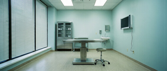 Clean surgical room with stainless steel equipment ready for medical procedures