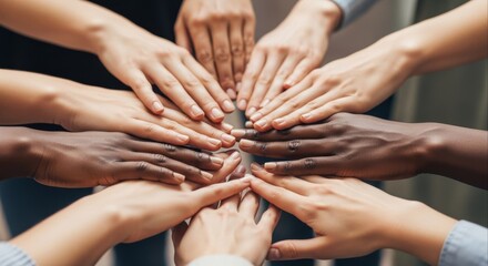 Close-up of diverse hands stacking together in a circle, symbolizing teamwork, unity, and collaboration among multi-ethnic people
