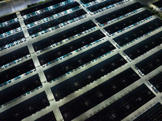 Night View of Solar Canopy Parking Lot with Illuminated Panels
