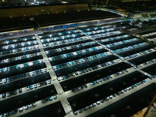 Night View of Solar Canopy Parking Lot with Illuminated Panels