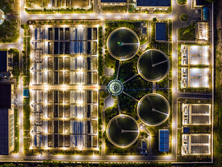 Aerial Night View of Illuminated Wastewater Treatment Plant