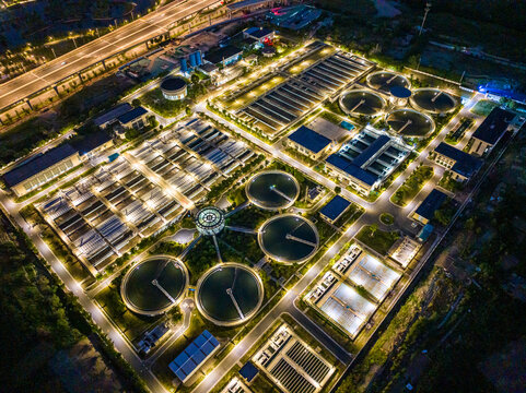 Aerial Night View of Illuminated Wastewater Treatment Plant