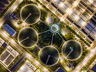 Aerial Night View of Illuminated Wastewater Treatment Plant