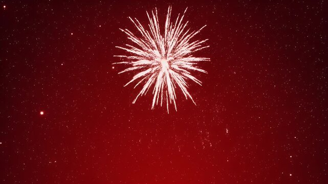 A single white firework bursts with sparkling light against a dark sky