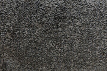 Black industrial rubber texture with pebbled cross-hatch pattern for background, 3D mapping, or overlay design.