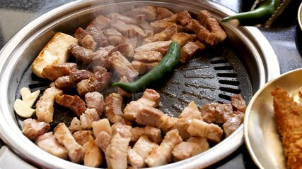 Grilling Pork Belly and Vegetables on Korean Barbecue Grill