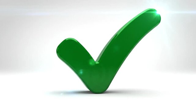 Shiny green check mark stands on a plain background