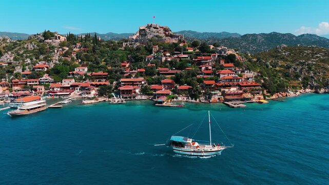 Aerial view of Kalek&ouml;y (Simena), a historic coastal village with its ancient Simena Castle overlooking the bay in Antalya, Turkey.