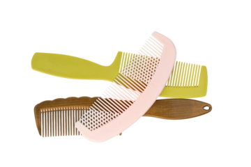 Colorful collection of hair combs featuring various designs, including a pink plastic comb with fine teeth and other vibrant hair products on Transparent Background.