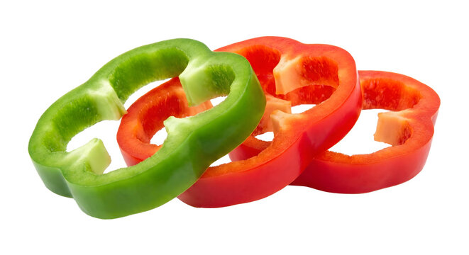 Freshly cut colorful bell pepper slices in red and green against a black background