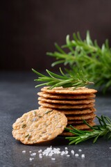 healthy snacks, like thin round crackers with herbs and salt on top