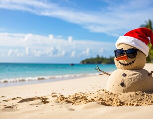 Obraz premium Playful sand snowman with sunglasses and Santa hat on sunny tropical beach with blue sky and sea, cheerful holiday spirit in a seaside Christmas setting