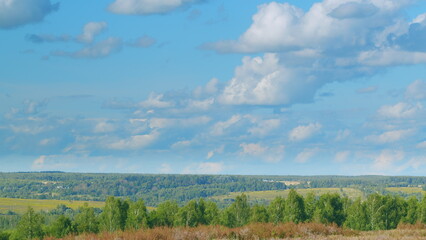 A beautiful and scenic landscape showcasing lush greenery contrasted against a cloudy sky