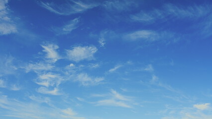 A Beautiful and Serene Blue Sky that is Adorned with Wispy, Fluffy Clouds on a Bright, Sunny Day