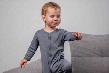 A toddler taking confident early steps at home.