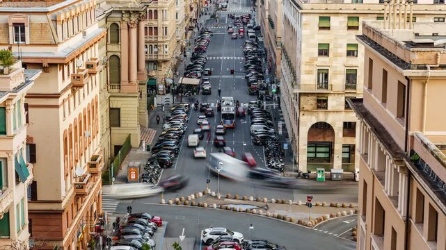 Aerial time lapse of fast moving traffic corner in European historic city high angle