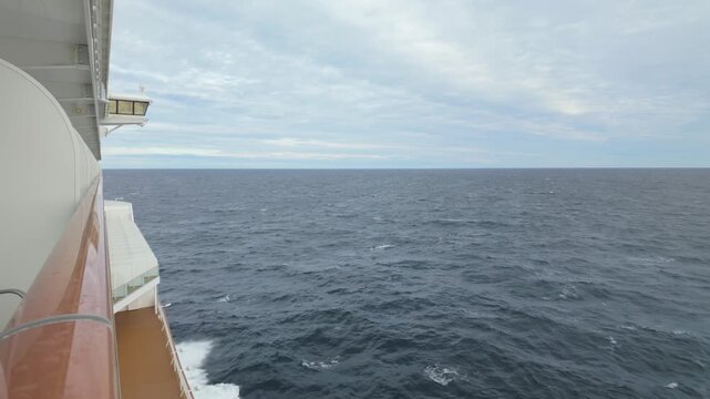 Gimbal wide shot from the balcony of a moving cruise ship traveling through the open ocean in the Pacific Northwest. 4K at 30 FPS