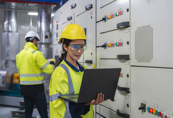 Engineers perform a detailed inspection of industrial ventilation units for efficiency.