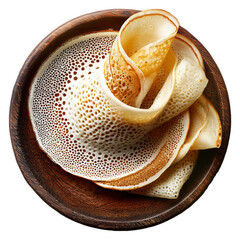 Sago Pancakes thin crepes or stack of pancakes topped with powdered sugar on wooden plate, isolated on white transparent background, Papua New Guinea breakfast