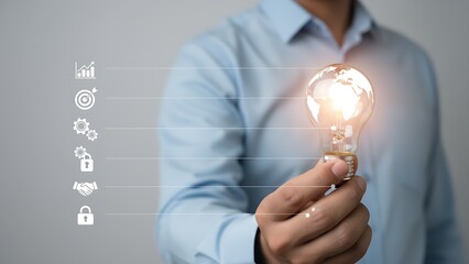 Businessman holds glowing light bulb with global map and linked icons symbolizing innovation, growth, security and collaboration