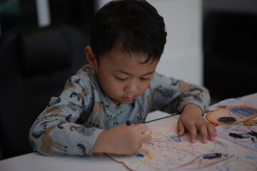 little boy drawing